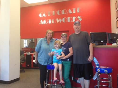Lori and Brian Keenan always make their visits to Corporate Autoworks a family affair. They posed with their youngest daughter with Stephanie Hill, co-owner.